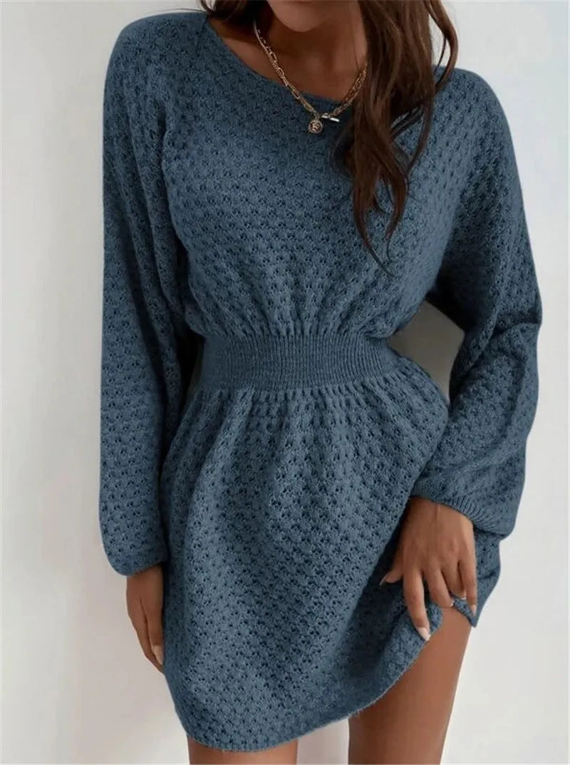 Blue women's knitted dress with crocheted flowers, a round neck, fitted waist, and long sleeves.