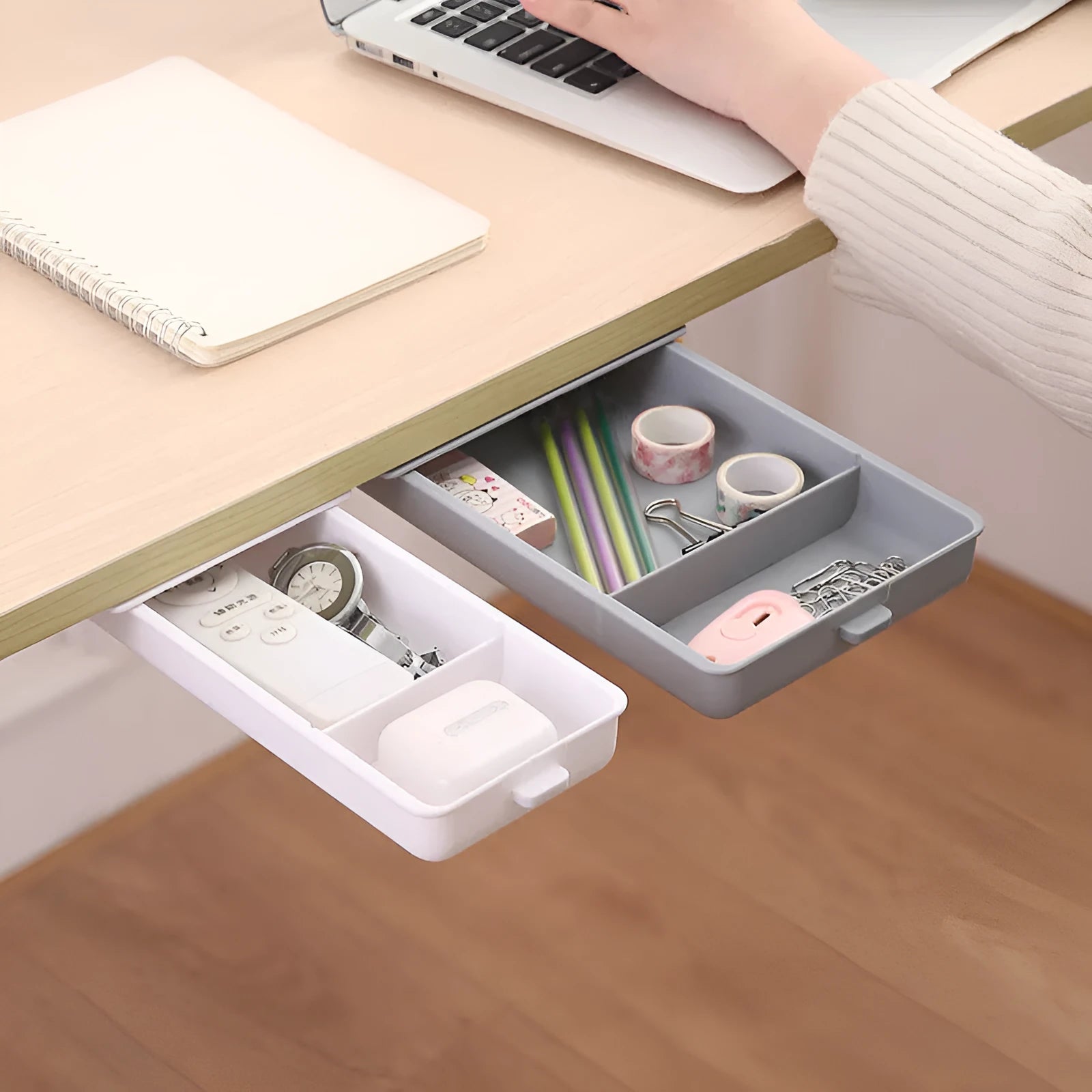 Plastic adhesive under-desk storage drawer with cover, shown in various colours and sizes.