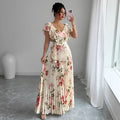 Apricot floral print women's dress with V-neck, ruffled short sleeves, and a high-waisted oversized skirt.