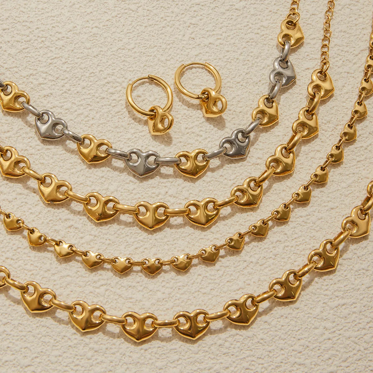 Stainless steel necklace and earrings set for women with bracelet and one pair of earrings in Love Light Luxury style
