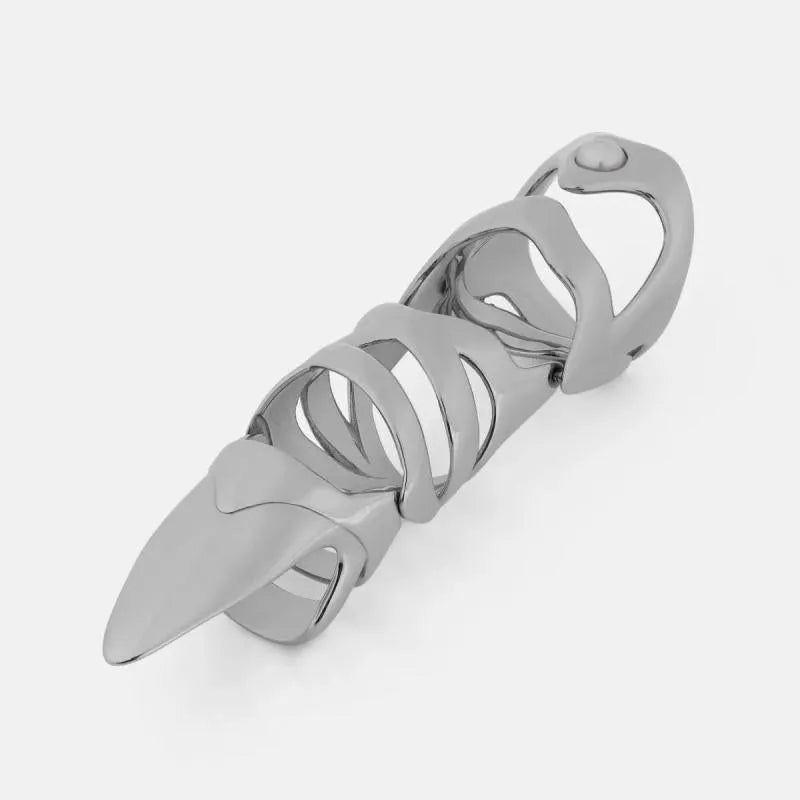 Silver punk armour finger stall ring on a finger, showing its one-piece, layered metal design.