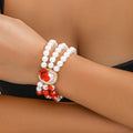 Halloween jewellery set with gold tone necklace, bracelet, and earrings featuring pearl accents