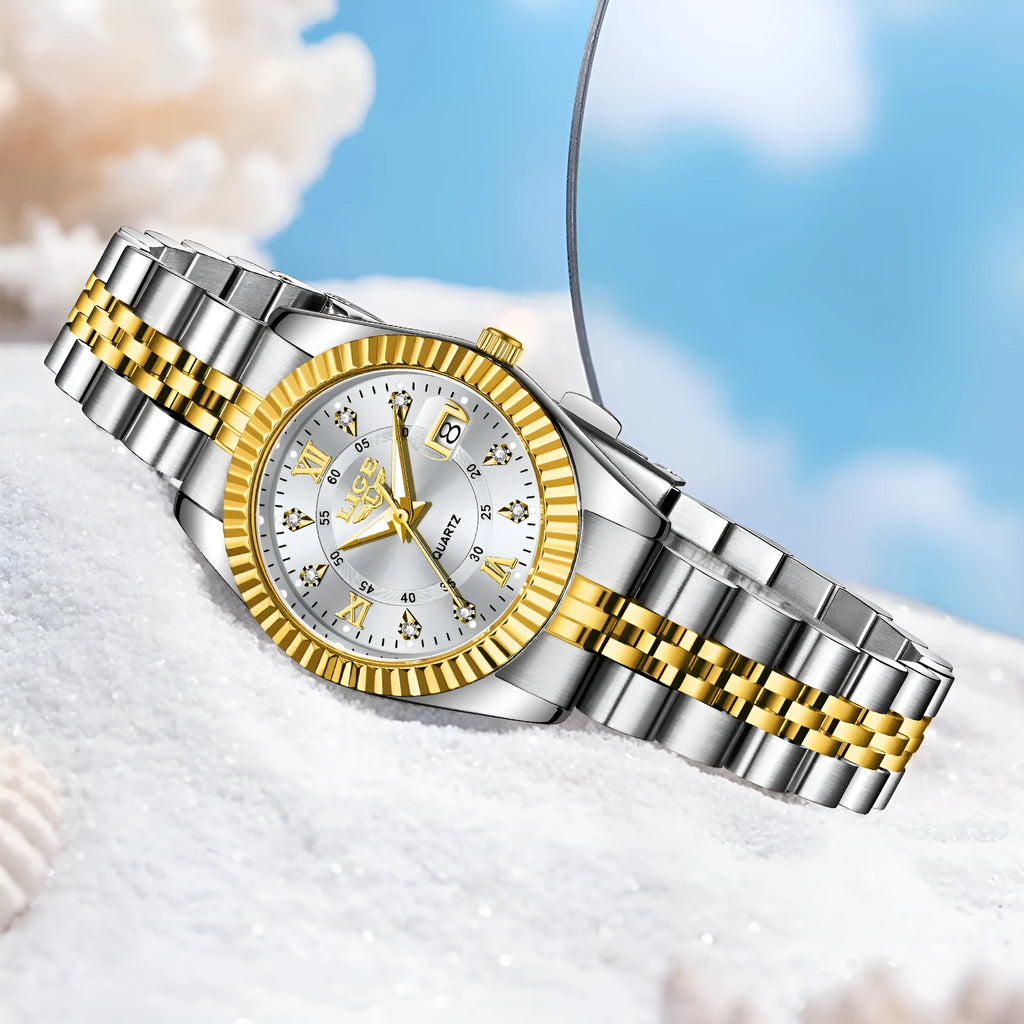 Waterproof quartz ladies watch with gold tone case on a wrist, showing a white dial.