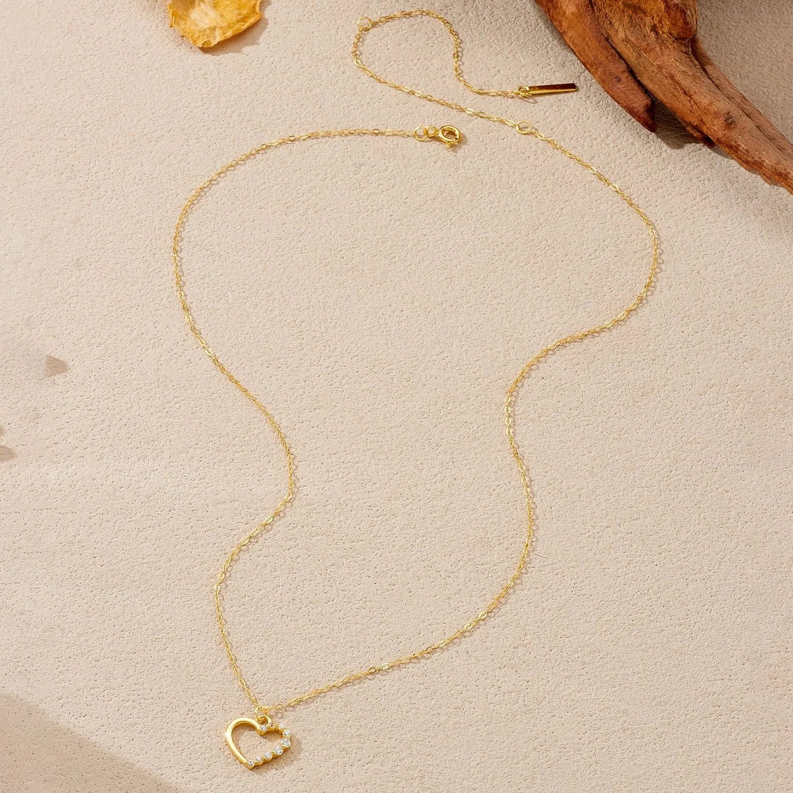 S925 sterling silver hollow heart pendant necklace with regular chain, available in white gold or 18K gold finish.