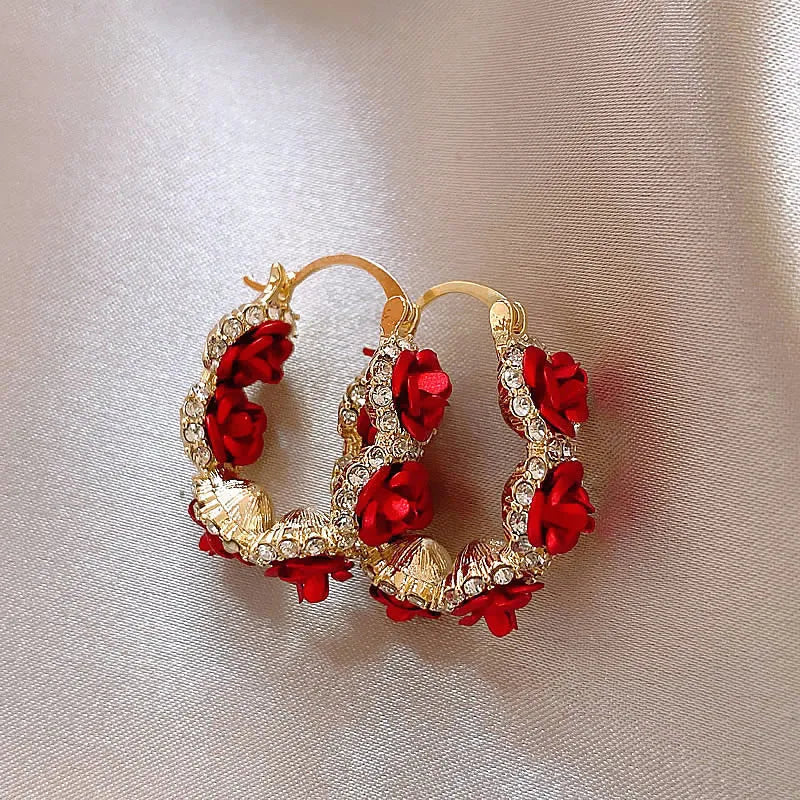 Red flower-shaped alloy ear clip earrings with rose design elements for women