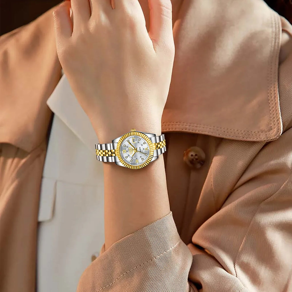 Waterproof quartz ladies watch with gold tone case on a wrist, showing a white dial.