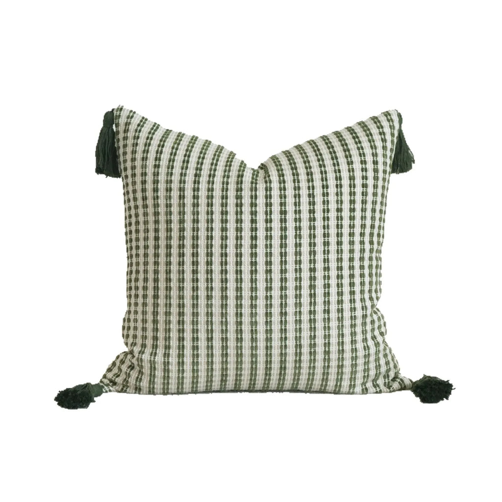 Green cotton linen decorative pillow with tassel, featuring a botanical leaf pattern, for hotel sample rooms.