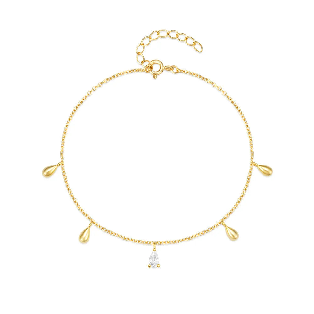 S925 sterling silver bracelet with gold tone water drop diamond pendant on a wrist.