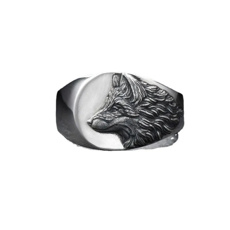 Silver geometric wolf head men's alloy ring on a grey background.