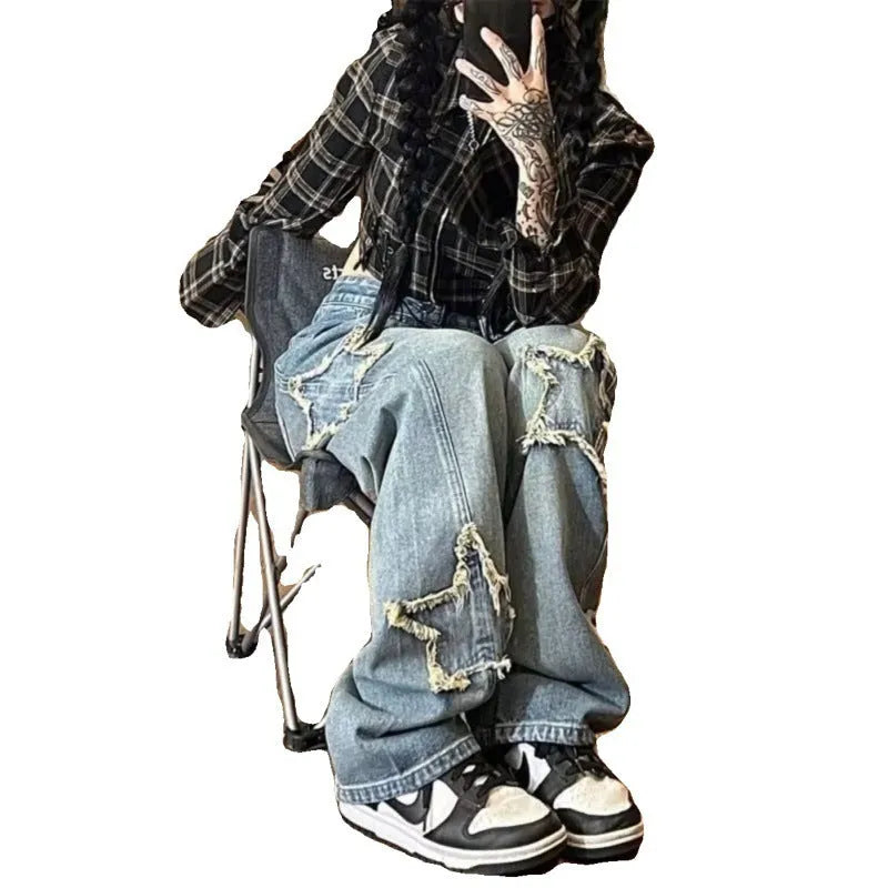 Blue high-waisted straight-leg women's jeans on a neutral background.