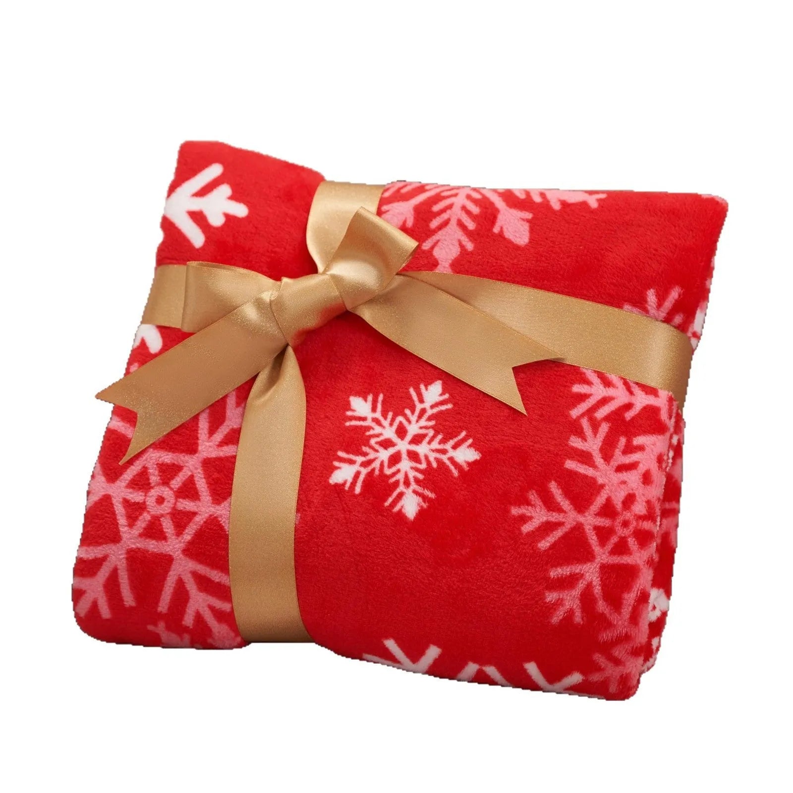 Soft red plush Christmas blanket draped over a bed, showing its flannel texture.