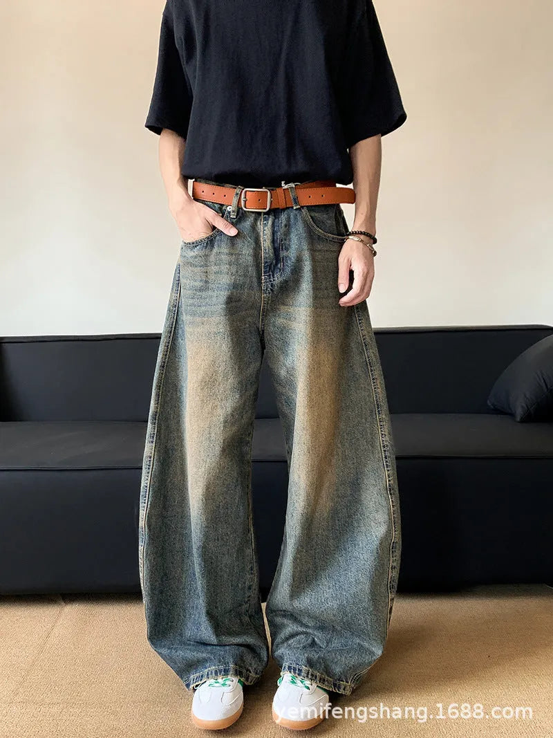 Men's distressed denim jeans in retro blue colour with wide-leg design and mid-waist fit