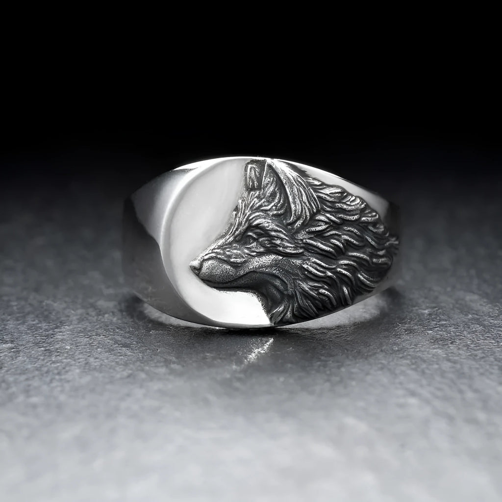 Silver geometric wolf head men's alloy ring on a grey background.