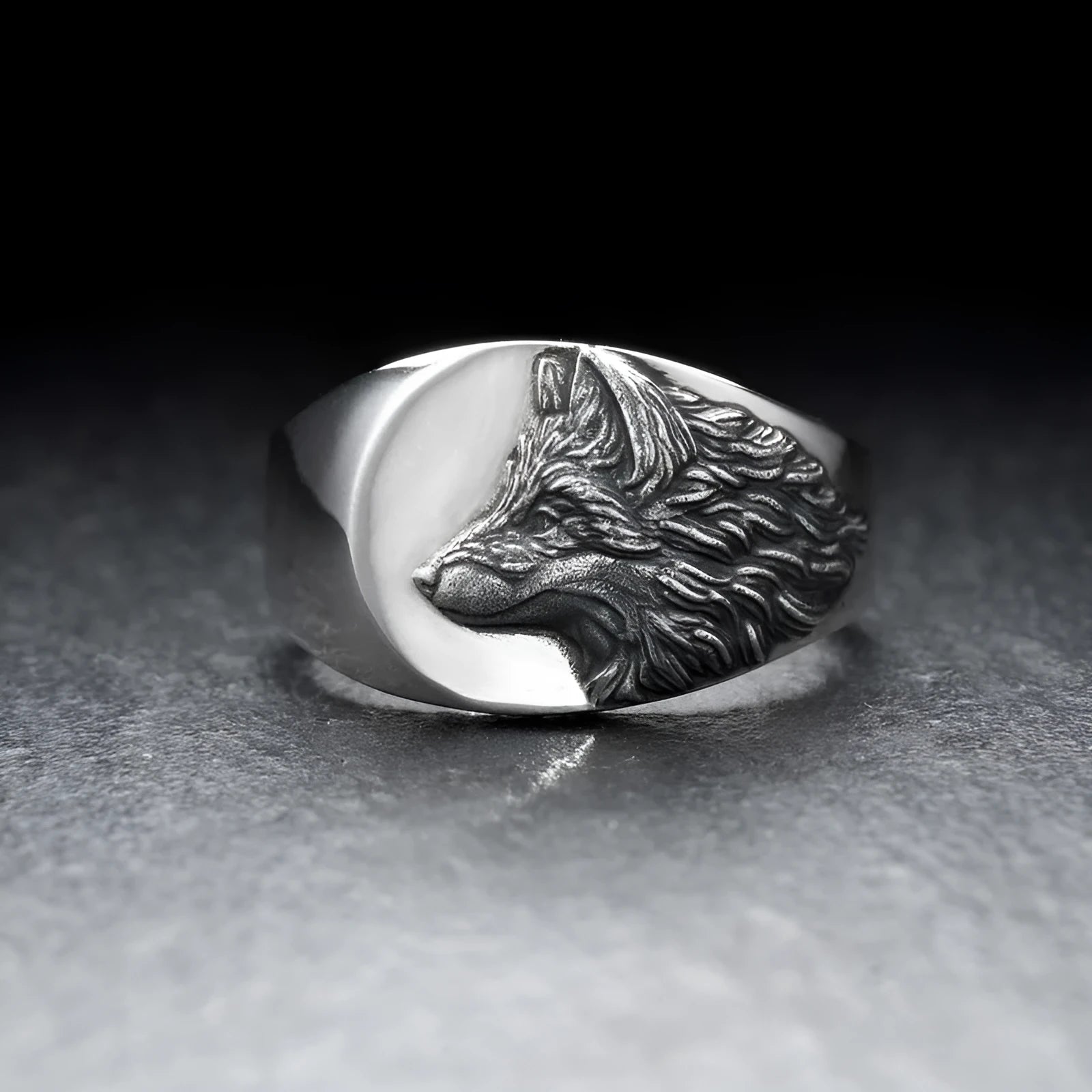 Silver geometric wolf head men's alloy ring on a grey background.