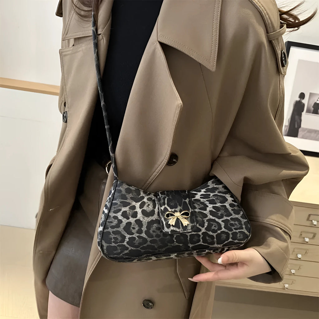 Women's casual PU leather handbag with sandwich pockets in brown colour showing 27cm length