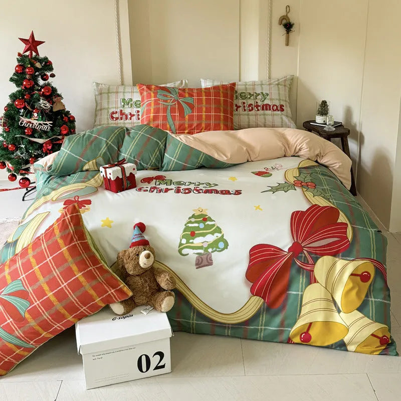 Christmas cartoon print bedding four-piece set on a bed, showing duvet cover and pillowcases in a festive pattern.