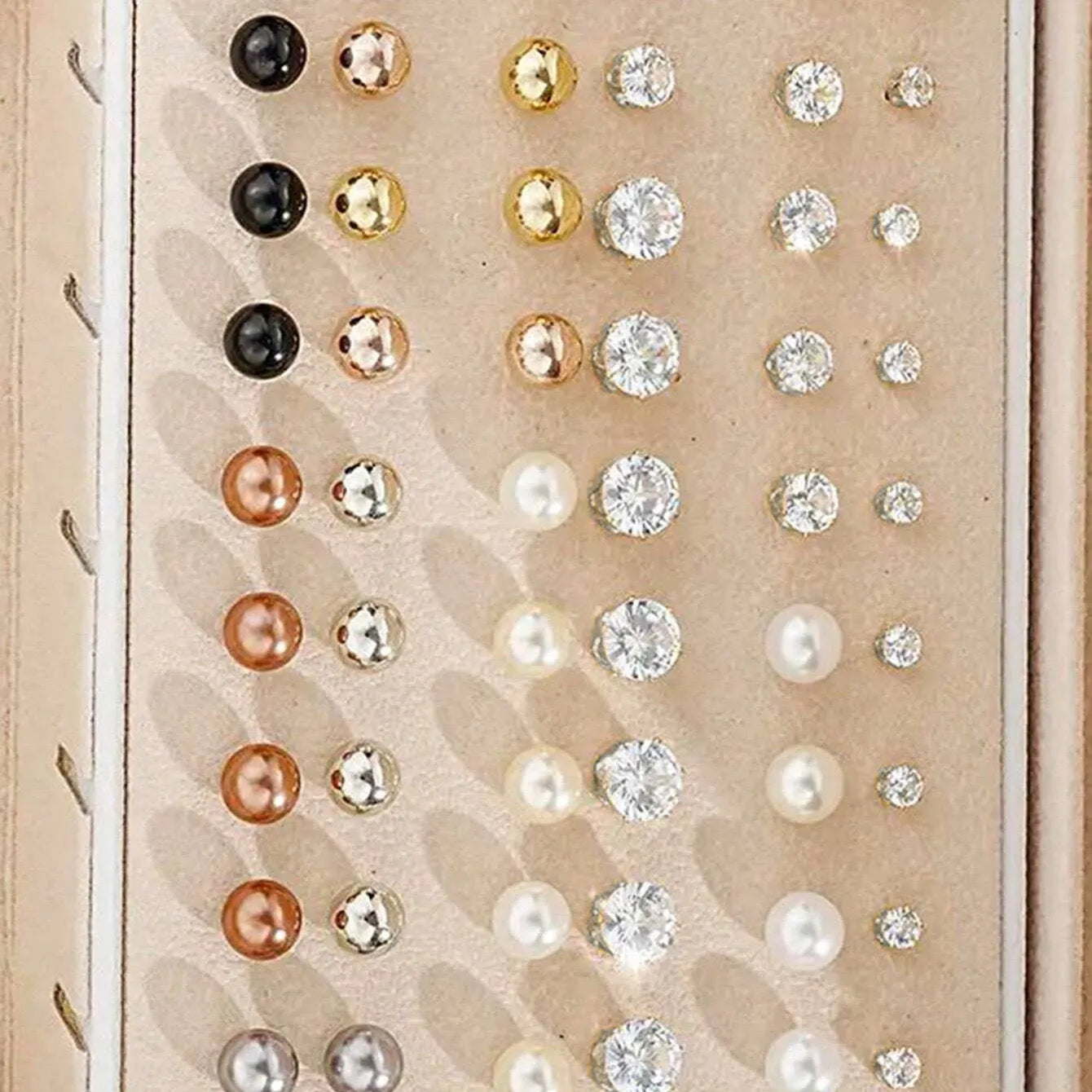 Assortment of 108 gold and yellow geometric alloy earrings with round pearl-like details on a white background.