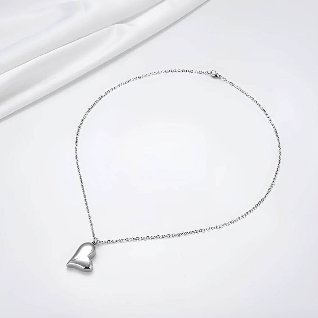 Silver curved peach heart stainless steel pendant necklace on adjustable length chain