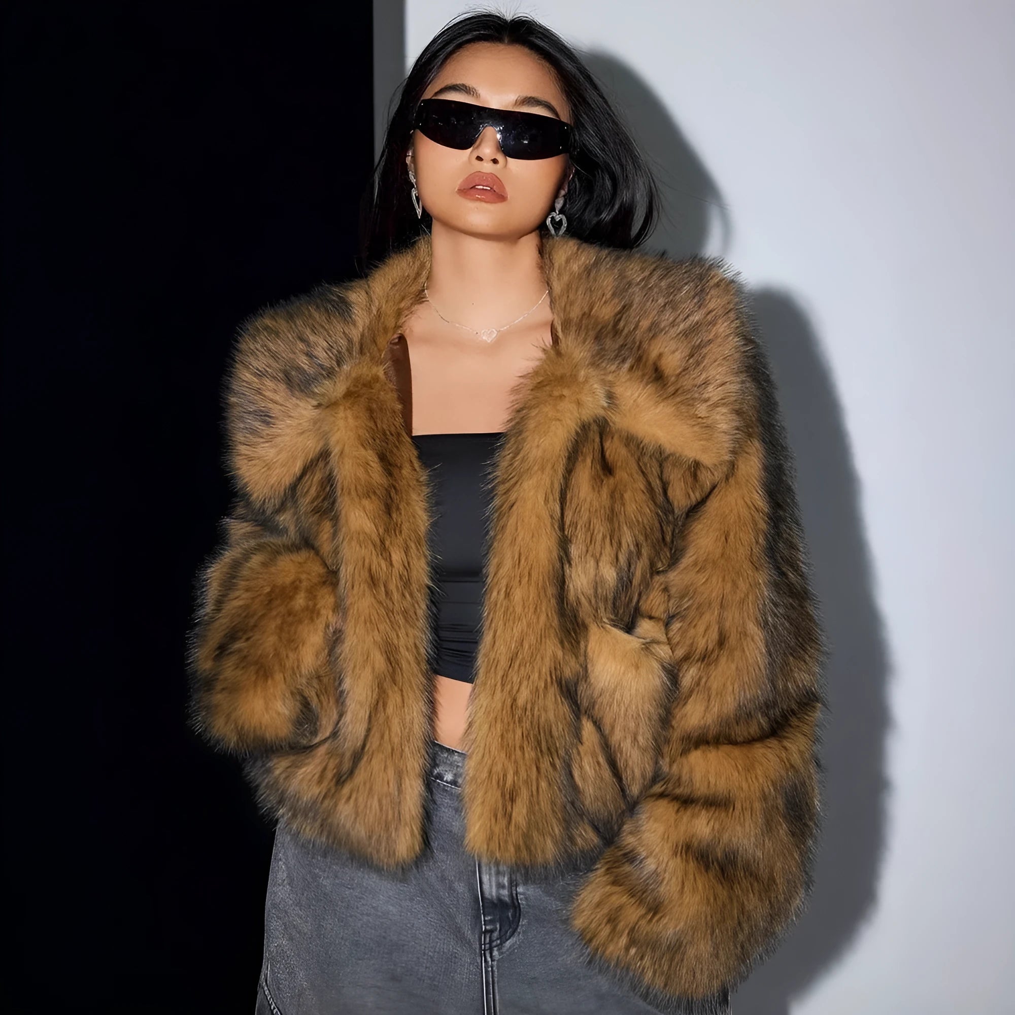 Women's short black tip artificial fur winter coat with a large fur collar and long sleeves.