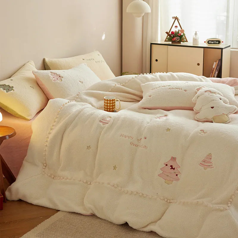 Milk fibre four-piece bedding set with green Christmas tree pattern on a double bed.