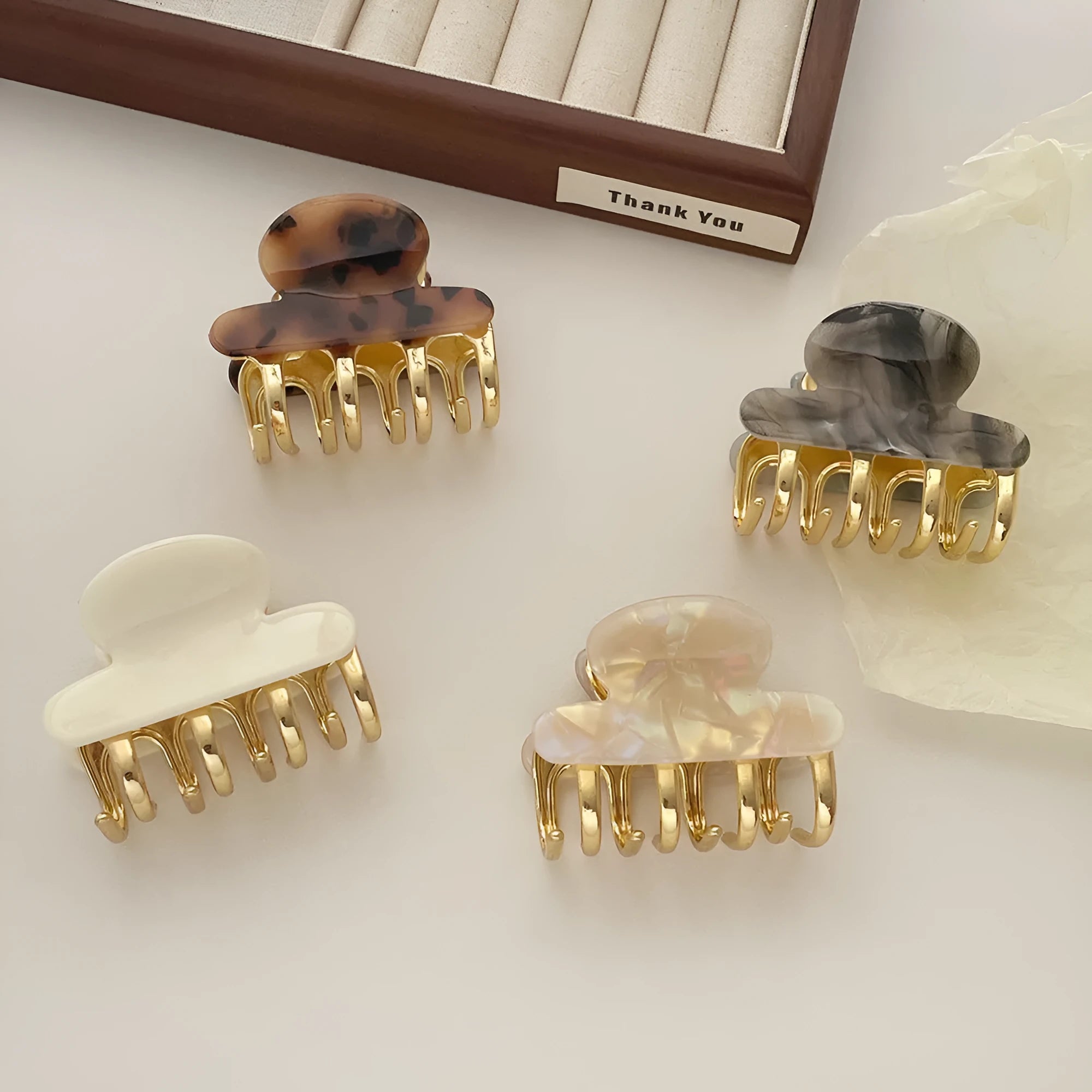 Women's retro acetate hair barrette with metal alloy grip in creamy-white, fairy white, ink colour, and leopard print variations