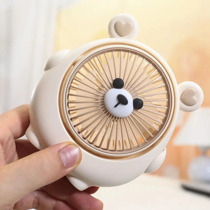 Small plastic desktop electric fan in a choice of six colours, including puppy-themed options, with USB cable.