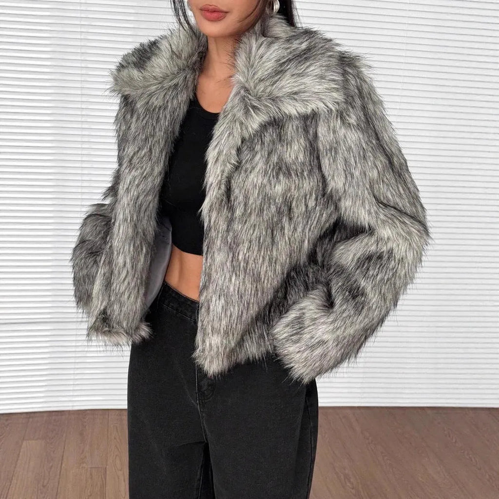 Women's short black tip artificial fur winter coat with a large fur collar and long sleeves.