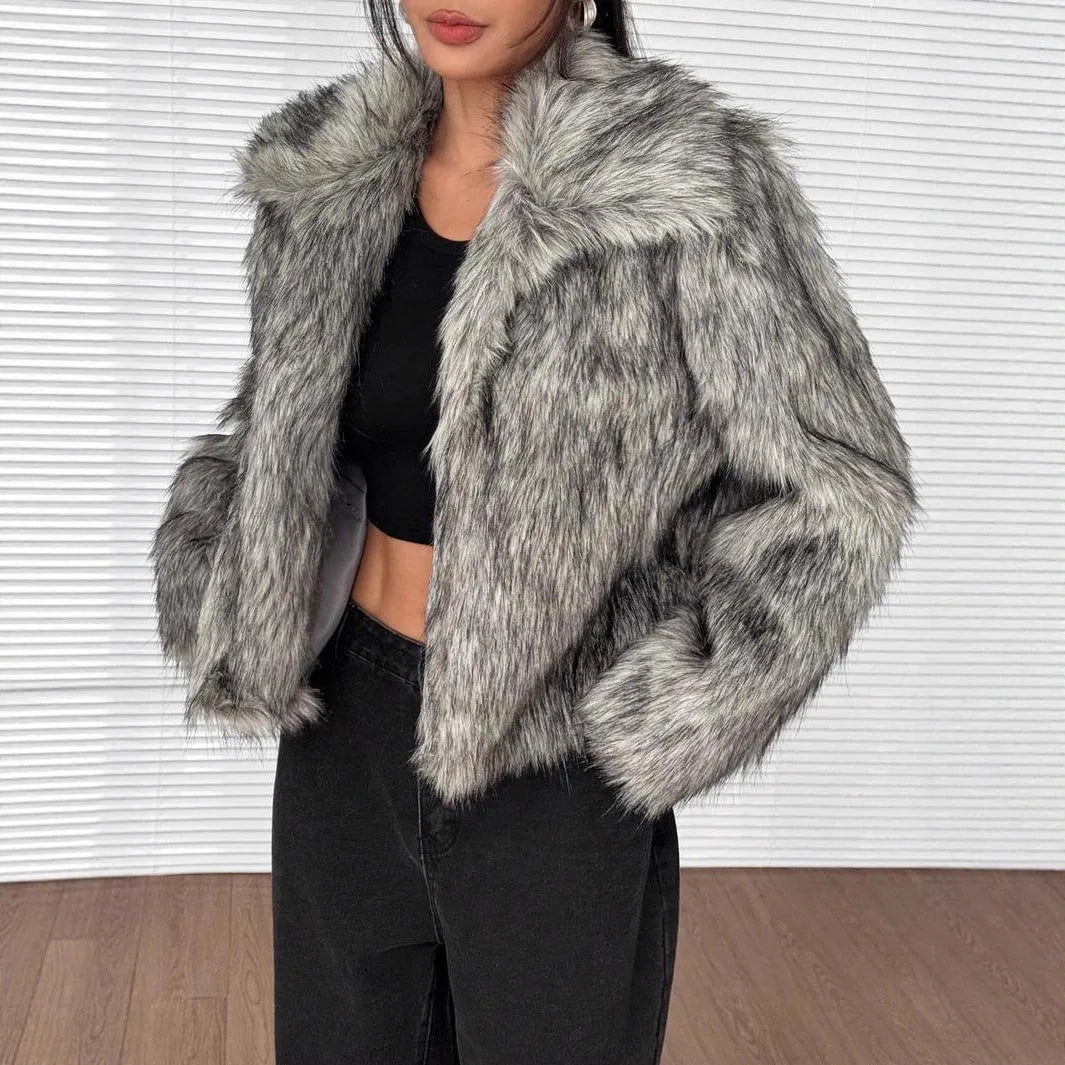 Women's short black tip artificial fur winter coat with a large fur collar and long sleeves.