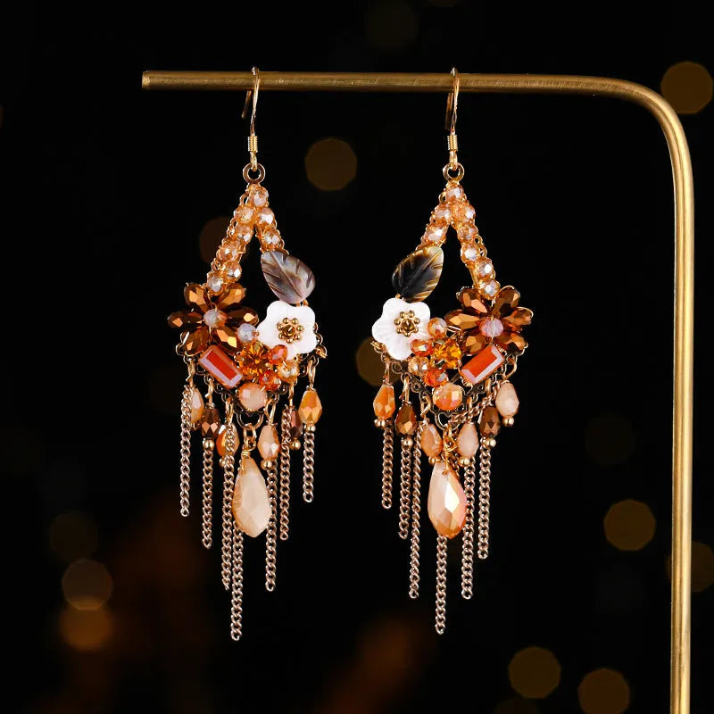 Bohemian style long earrings with hand-woven crystal details and alloy framework