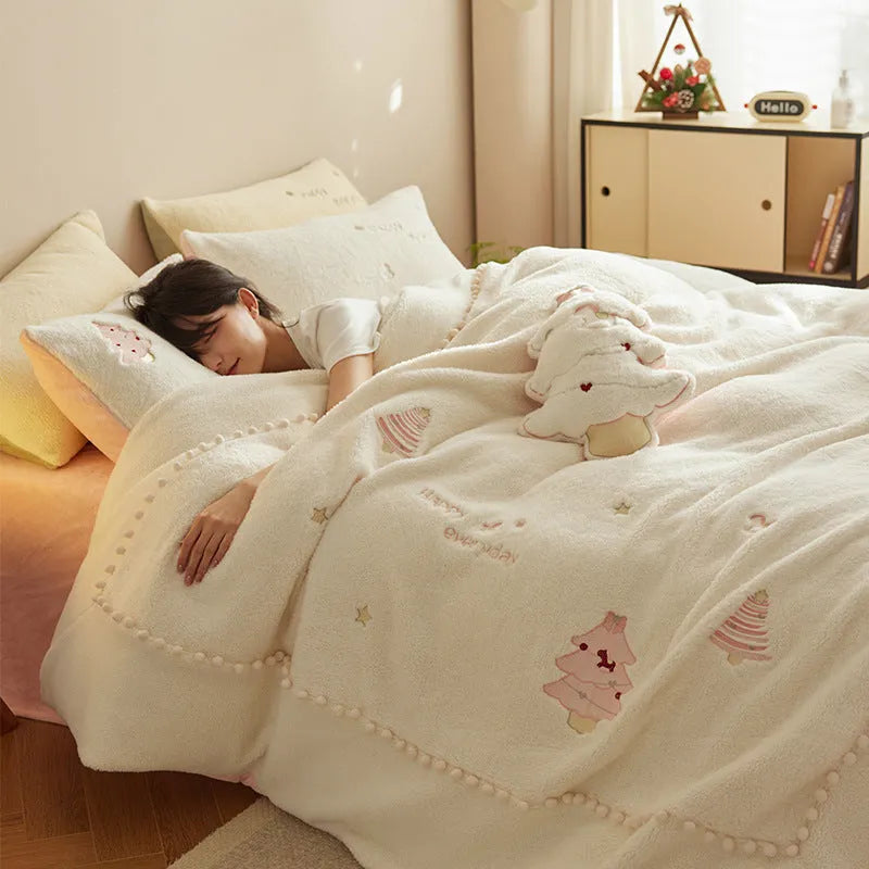 Milk fibre four-piece bedding set with green Christmas tree pattern on a double bed.