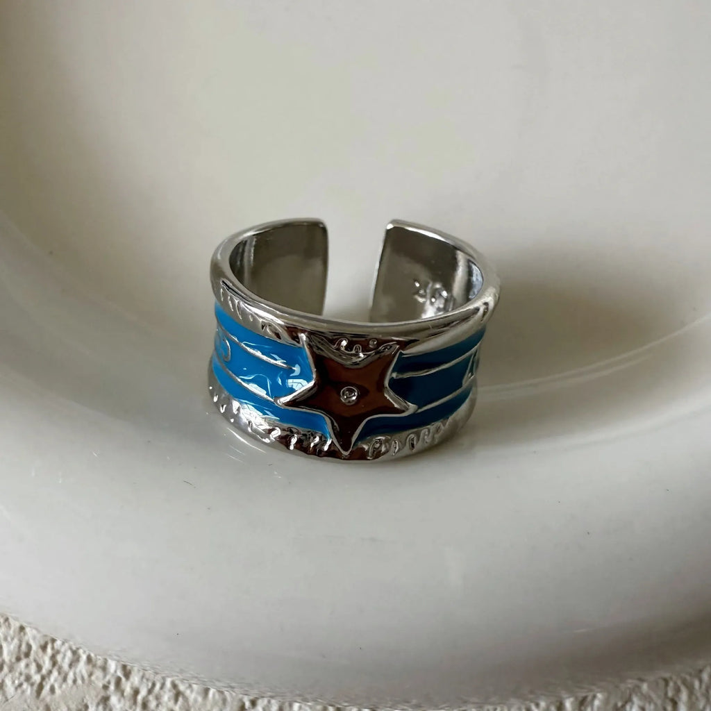 XINGX geometric drop oil ring in a retro distressed finish with adjustable sizing.