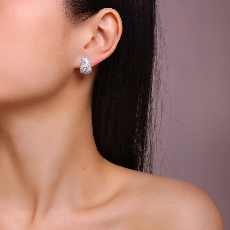 Geometric sterling silver ear studs with moissanite design in white colour