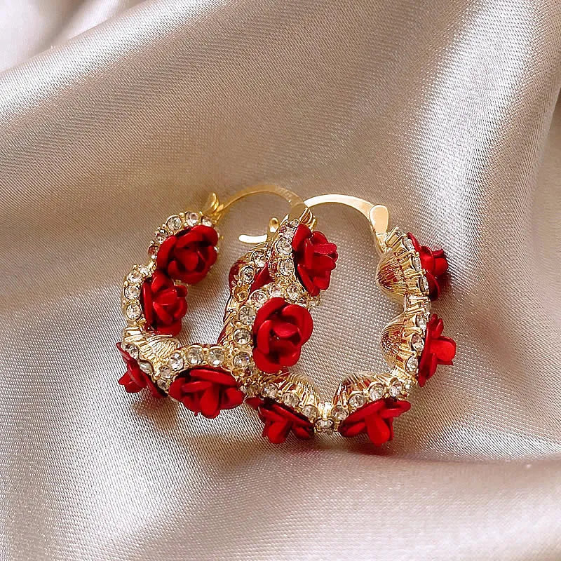 Red flower-shaped alloy ear clip earrings with rose design elements for women