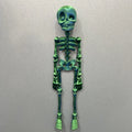 3D printed PLA skull refrigerator magnet in modern art style for Halloween decoration.