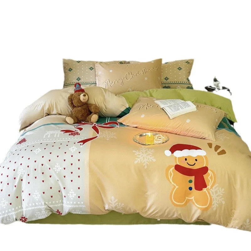 Christmas cartoon print bedding four-piece set on a bed, showing duvet cover and pillowcases in a festive pattern.
