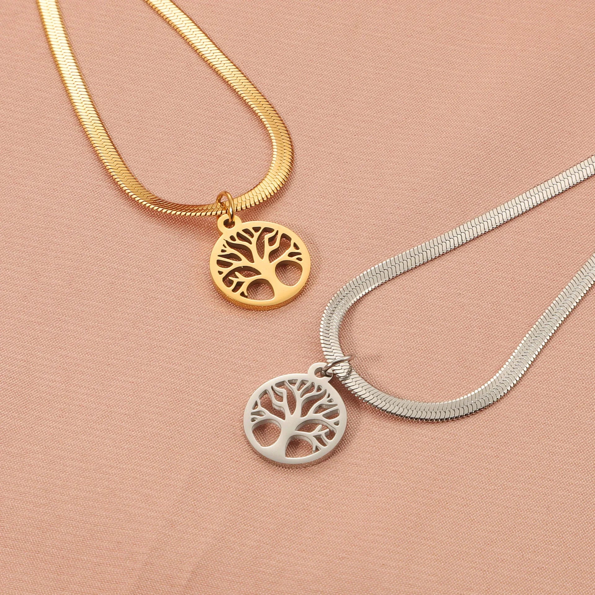 Gold and steel colour adjustable lucky tree pendant necklaces on a snake bones chain.