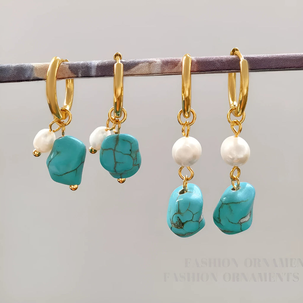 A pair of geometric clip-on earrings made of copper with turquoise and cultured pearls.
