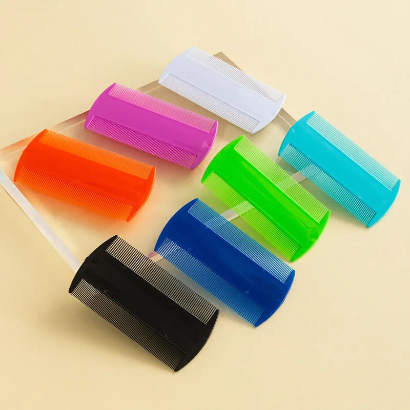 Close-up of a double-edged fine-tooth lice comb with coloured plastic handle and metal teeth.