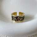 XINGX geometric drop oil ring in a retro distressed finish with adjustable sizing.
