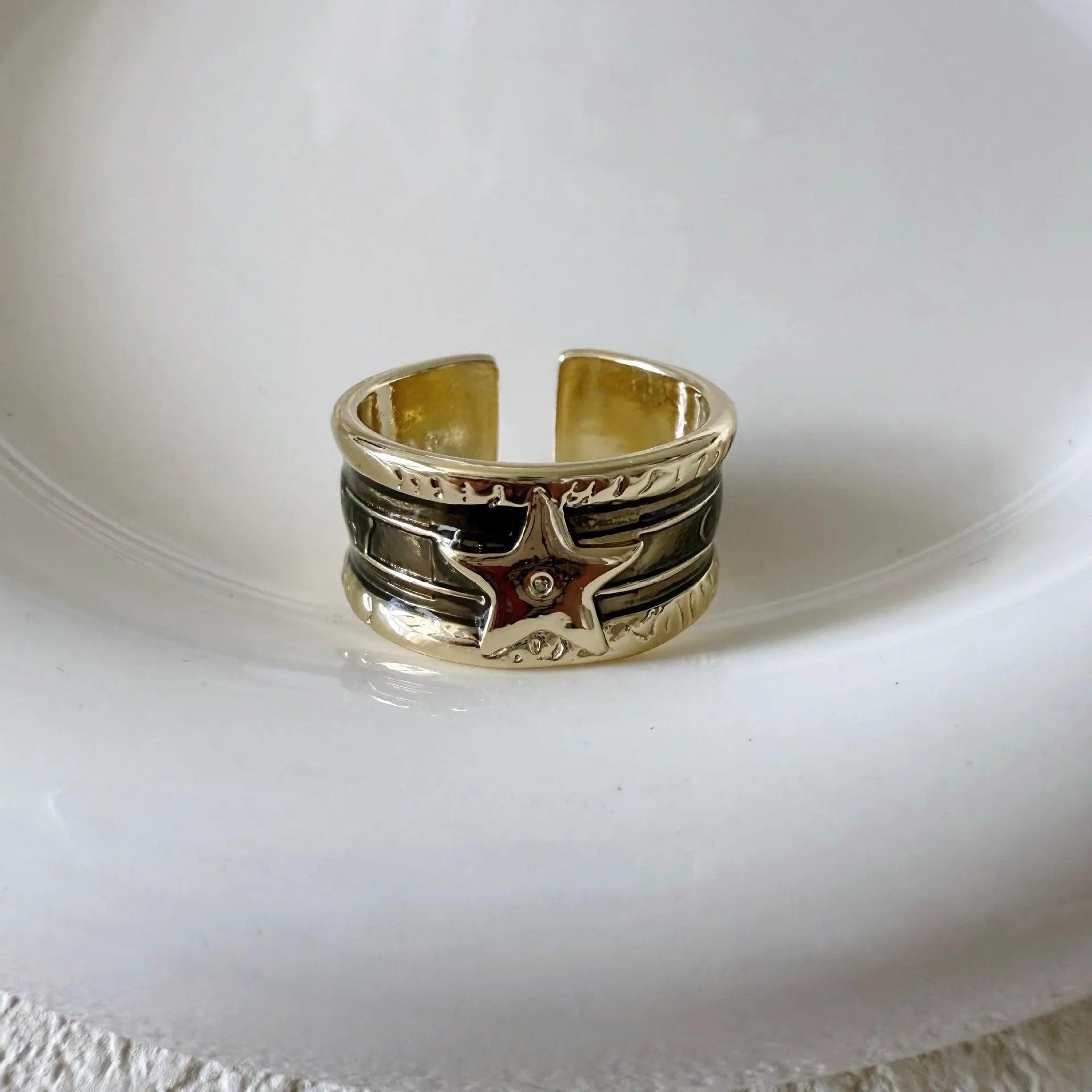 XINGX geometric drop oil ring in a retro distressed finish with adjustable sizing.