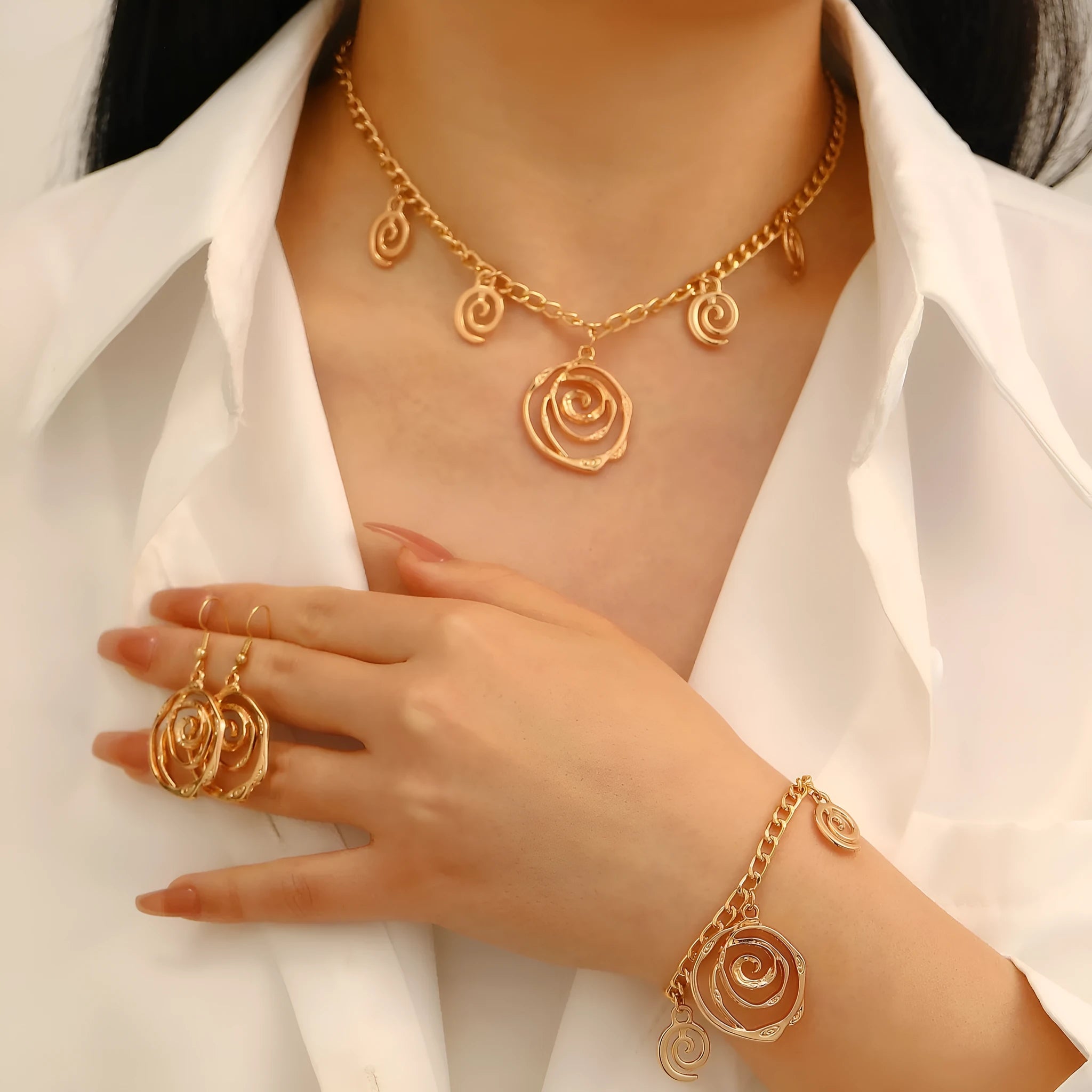 Spiral donut women's jewellery set showing necklace, bracelet, and earrings with geometry circle design