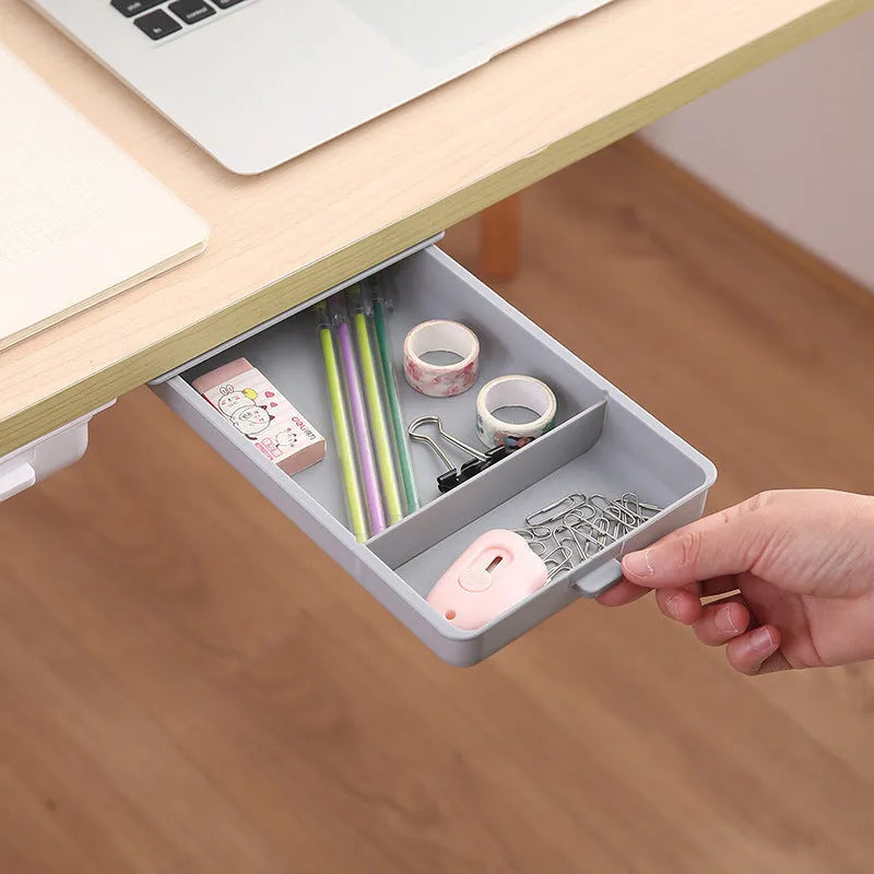 Plastic adhesive under-desk storage drawer with cover, shown in various colours and sizes.