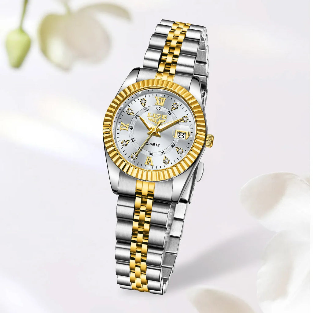 Waterproof quartz ladies watch with gold tone case on a wrist, showing a white dial.