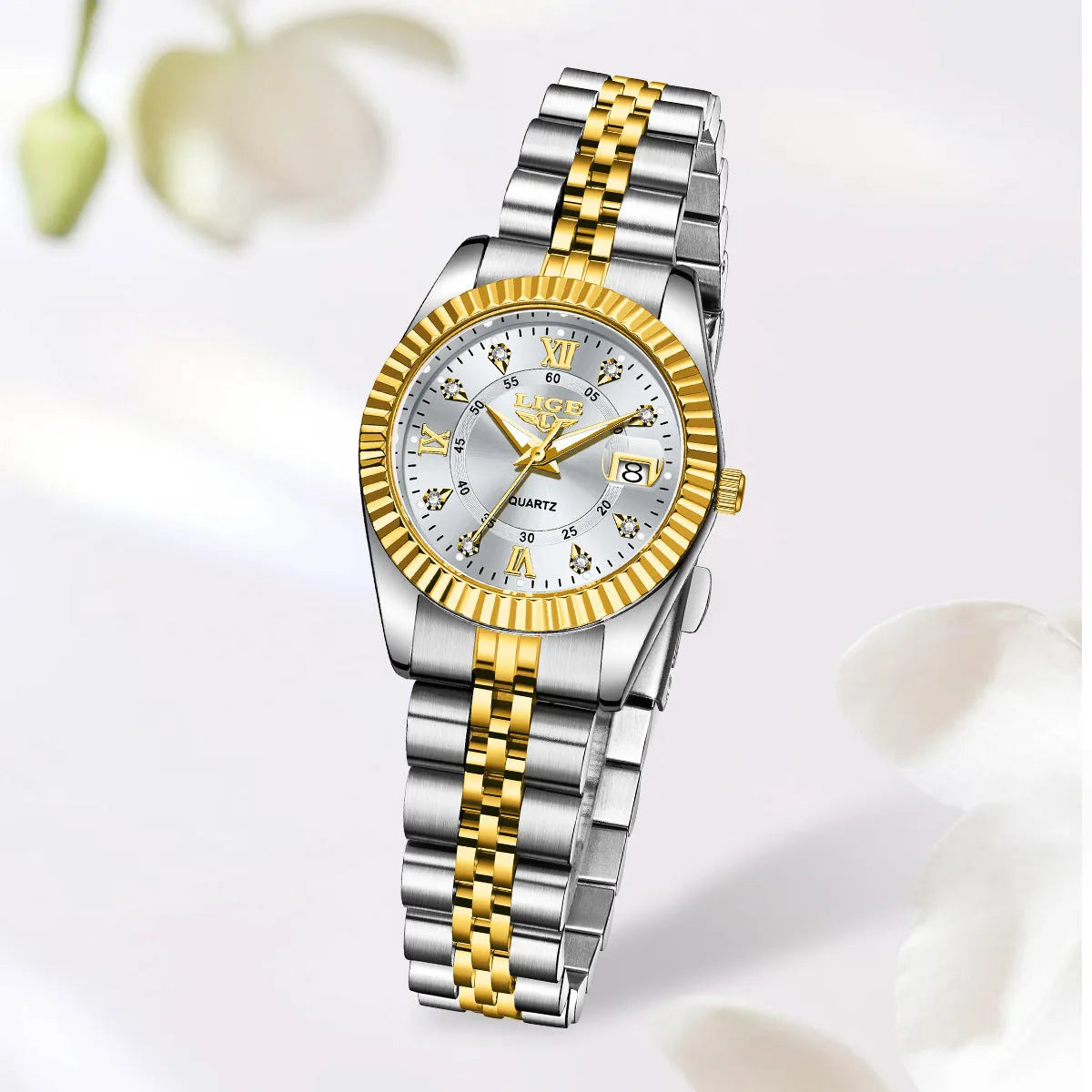 Waterproof quartz ladies watch with gold tone case on a wrist, showing a white dial.