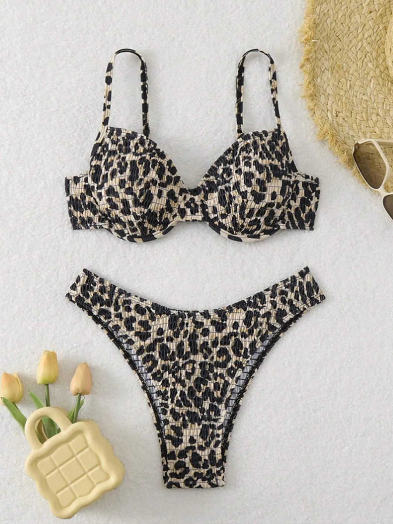 Women's backless leopard print bikini in brown mixed colour on a mannequin
