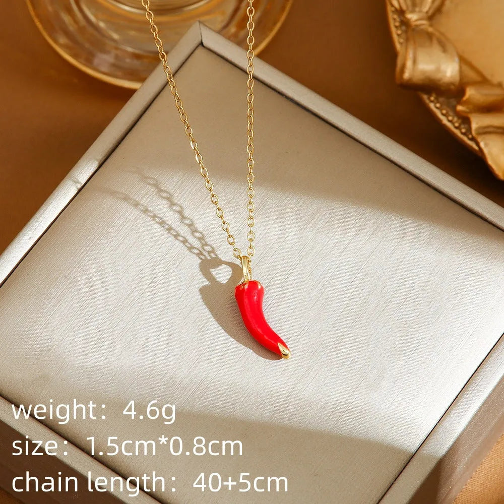 Delicate red indie cherry and strawberry pendant on a titanium steel O-ring necklace chain.