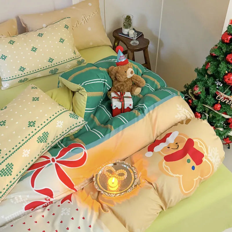 Christmas cartoon print bedding four-piece set on a bed, showing duvet cover and pillowcases in a festive pattern.