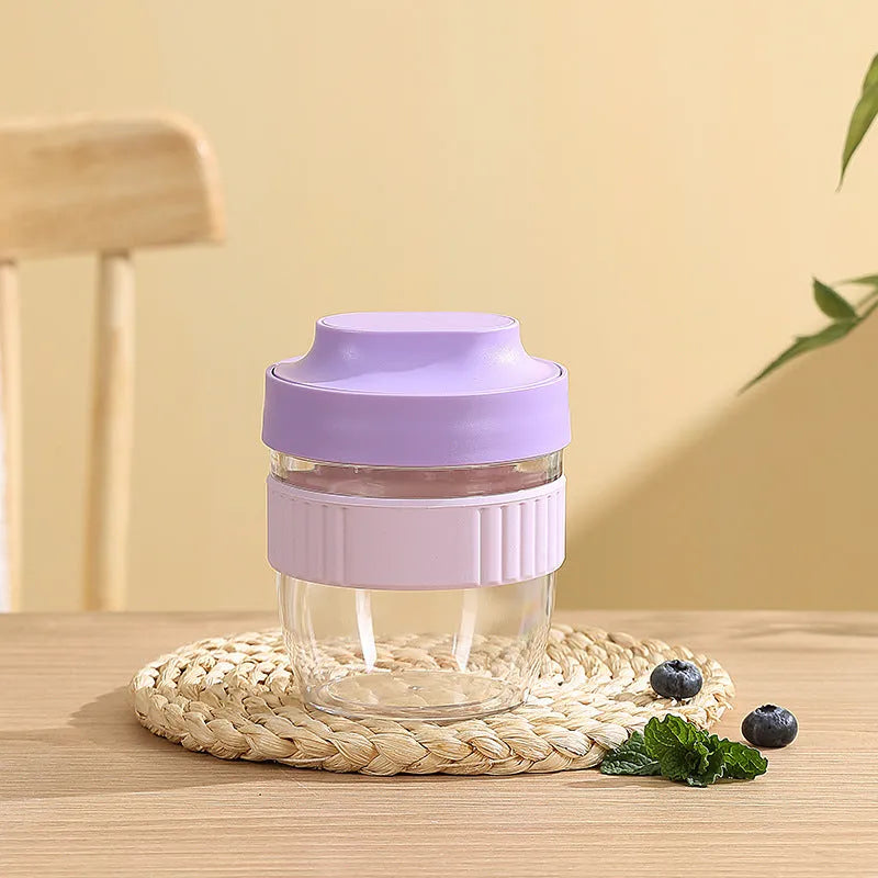 Green microwave-safe plastic salad cup with white lid and spoon, showing leak-proof seal.