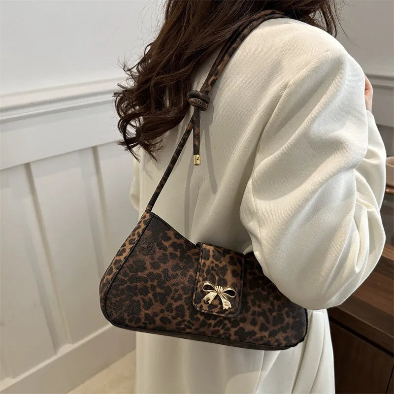 Women's casual PU leather handbag with sandwich pockets in brown colour showing 27cm length