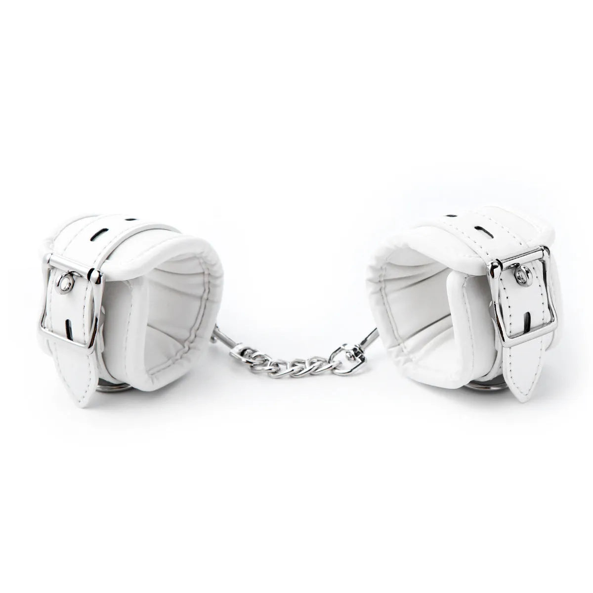 White PU sponge bondage set showing handcuffs, footcuffs, ankle bracelet, and neck scarf on a dark background.